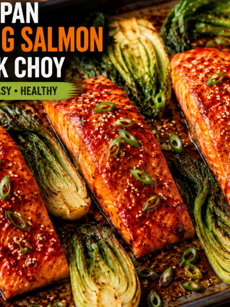 Featured image of sheet pan gochujang salmon with roasted bok choy, glazed with spicy Korean sauce and garnished with sesame seeds and green onions