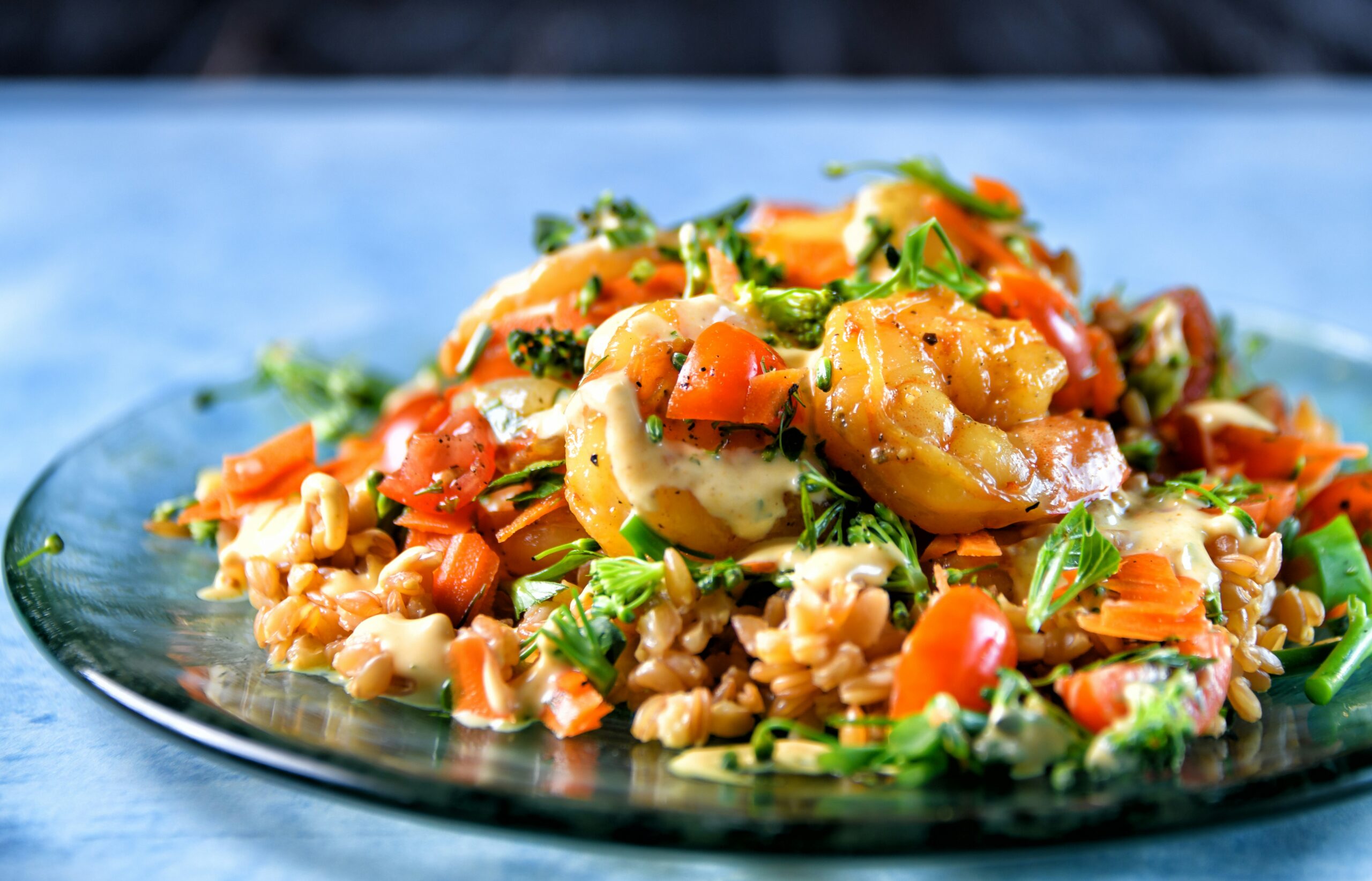 Asian shrimp stir fry with juicy shrimp, broccoli, bell peppers, snap peas, carrots, and onions cooked in a savory garlic soy sauce in a wok.